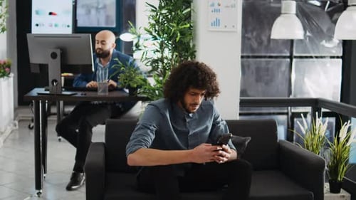 Startup Consultant Writing Data on Phone