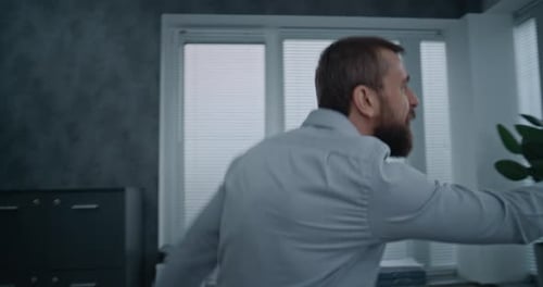 Furious Businessman Loses Temper Yells Walks Nervously in Office Room