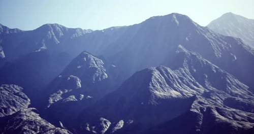 Majestic Mountain Range Under Clear Sky During Day Time