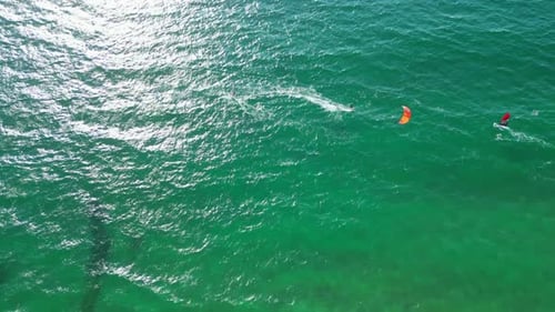 Bird's eye view of a kitesurfer making maneuvers in the sea at Guincho beach,Cascais,Portugal
