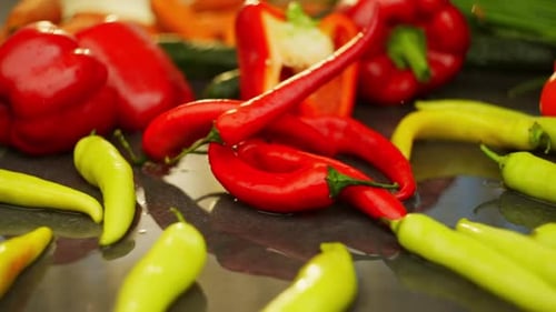 Spectacular Appearance of Red Hot Pepper Among Fresh Vegetables on the Table