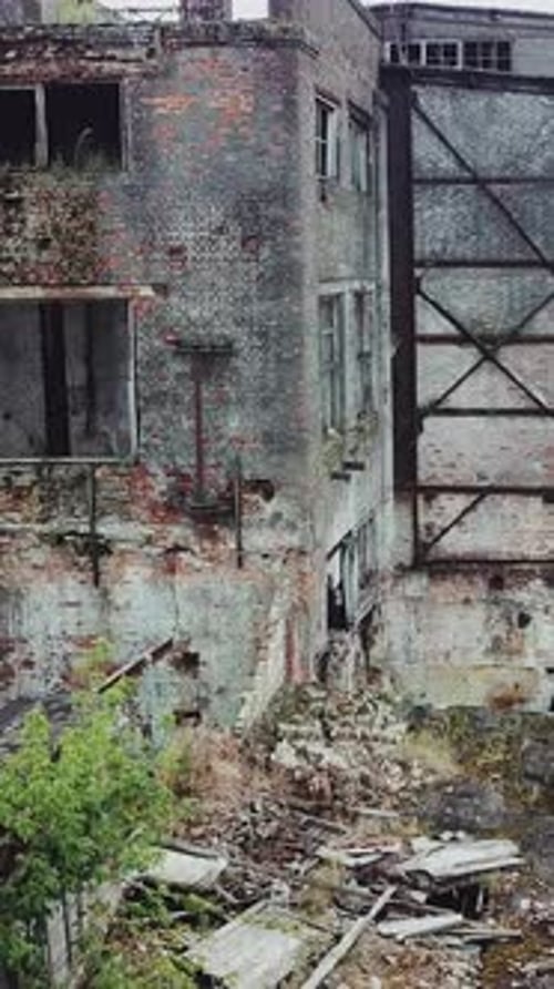 Aerial: Old Factory. Abandoned building exterior. Old factory building for demolition.