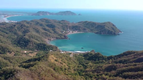 Stunning aerial view of mountains and blue ocean in Mexico. drone flying over a tropical beach of th