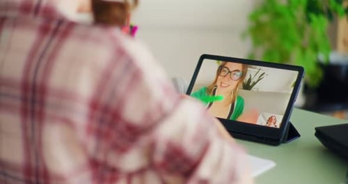 Woman Video Calling on Tablet Indoors
