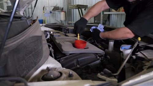 Inspection of the Engine and Checking the Engine Oil Level at a Service Station