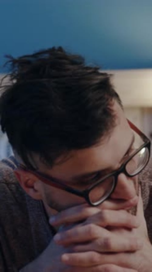 Couple In Bed Looking Sad