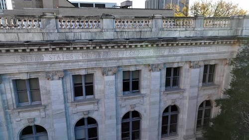 United States Post Office, Court House and Custom House building in city. Aerial establishing shot.