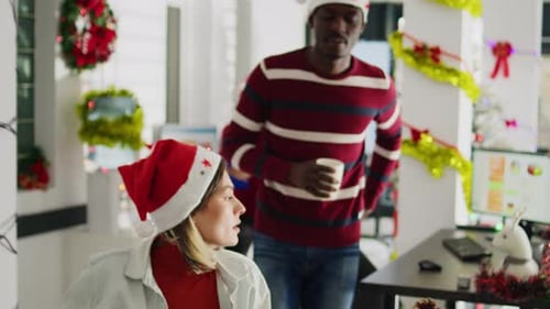 Coworkers in Xmas Office Chatting
