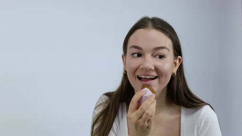 Young Woman Applies Makeup with Brush