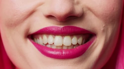 Woman Smiling Showing Bright Pink Lipstick Close Up