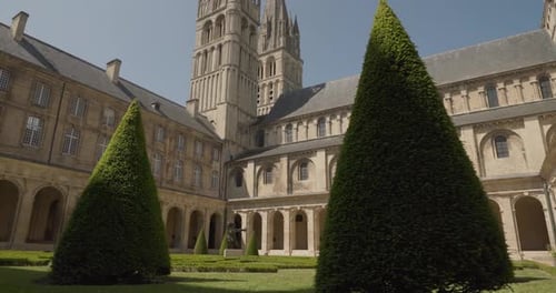 Historical Building Courtyard with Cone Shaped Bushes