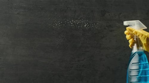 Cleaning Service Close Up of Woman Cleaning Table at Home with Spray Homework Clean of Ditry Kitchen