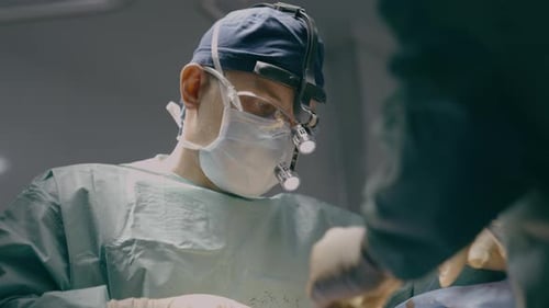 Two Doctors in Uniform Mask Physician Medic Man Surgeon Medical Nurse Perform Surgical Operation
