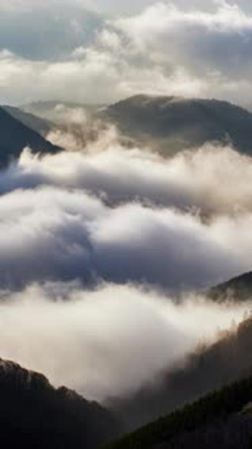 Vertical Timelapse of Mountain Fog and Sea of Clouds at Light of Sunrise D