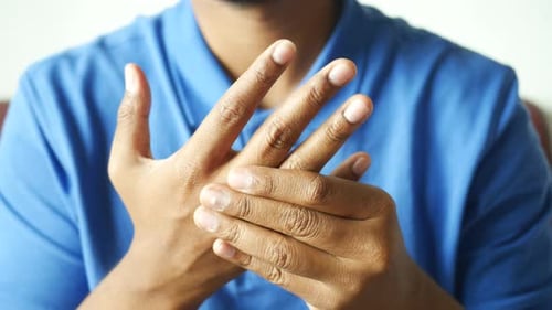 Man Suffering Pain in Hand Close Up