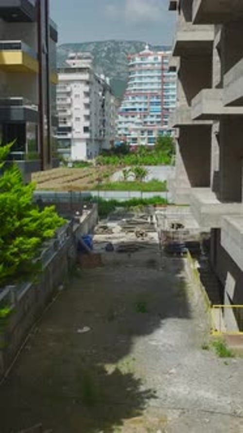 Vertical Drone Footage of Concrete Building Frame at Construction Stage