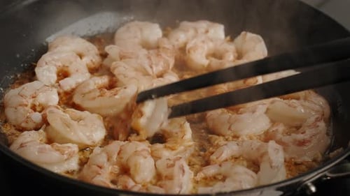 Process of Fries Shrimp in Pan with Olive Oil and Garlic in the Kitchen