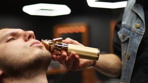 Man Getting a Beard Trim at the Barber