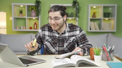 Young Adult on Video Call at Home Office