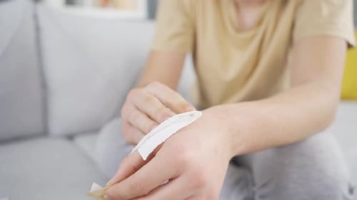 Applying Bandage to Hand in Home Setting