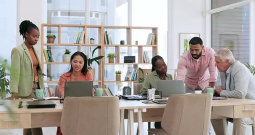 Meeting, laptop and business people planning in the office for a project in the boardroom together