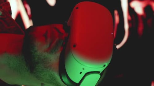 Man Wearing VR Headset in Dark Room