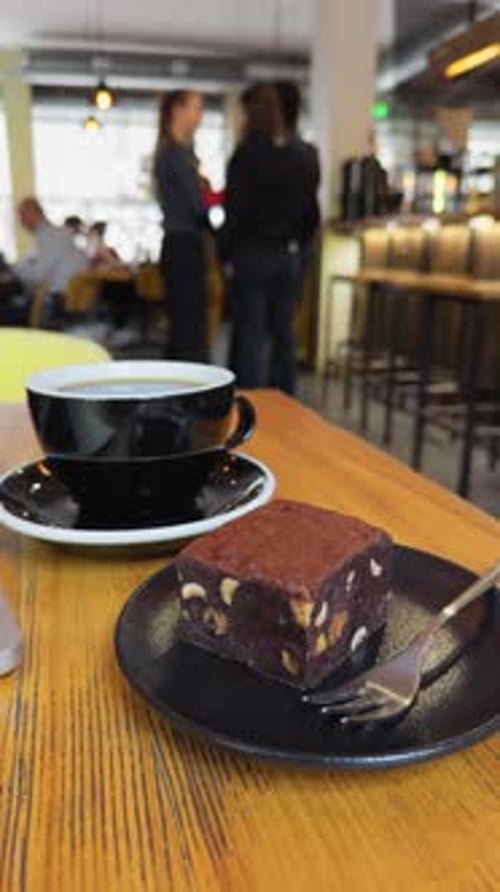 Savoring Coffee and Delicious Dessert Within a Cozy Cafe Ambiance That Invites Relaxation and