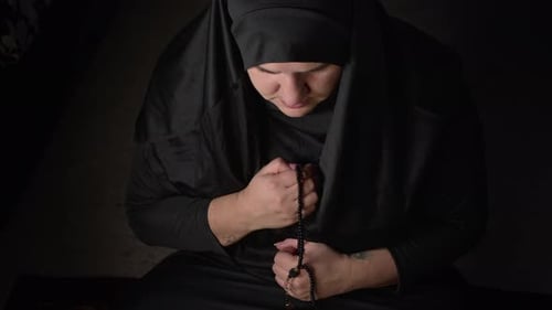 Young Muslim Woman In Black Prayer Clothes And Headscarf 07