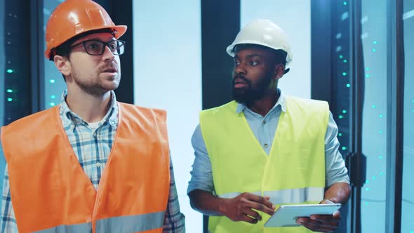 Two Engineers Inspect Data Servers, Construction Stock Footage ft ...