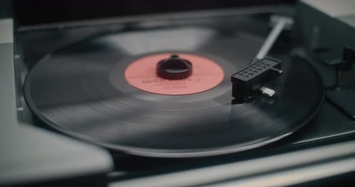 Black Vinyl Record Spinning on Player Close Up