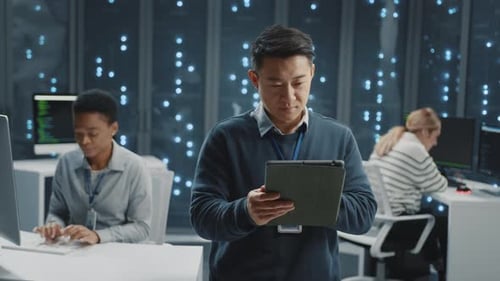 Cheerful Asian IT Software Developer Manager Operator Professional Staff in Modern Data Center