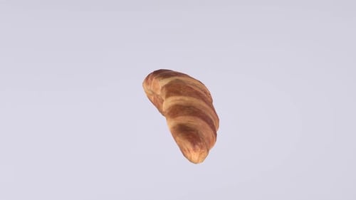 Golden Brown Croissant on Plain Background