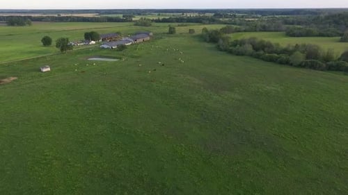 Country side panoramic landscape in summer time from above and ground with hay rolls and roads