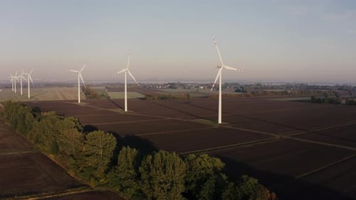 Aerial View Of Wind Turbines On A Rural Field At Sunrise Autumn Landscape