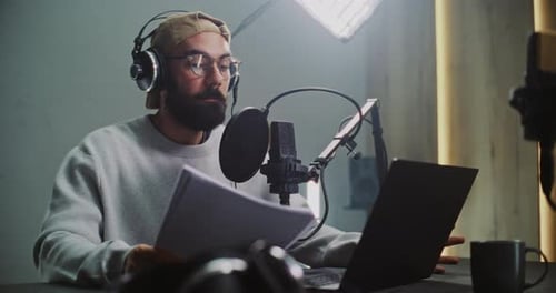 Professional Male Podcast Host Recording Episode in Studio