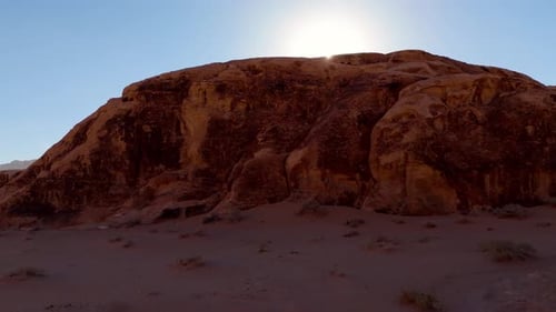 Backlit aerial view of desert mountains in Wadi Rum