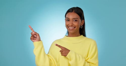 Face, woman and pointing to advertising in studio of deal, information about us