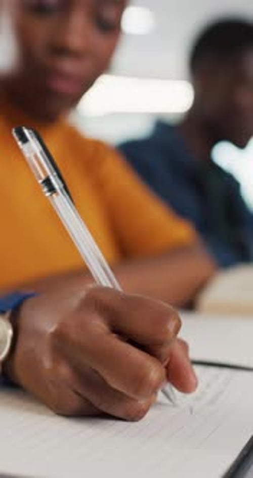 Notebook, hands and woman in classroom for writing, education or assignment at university