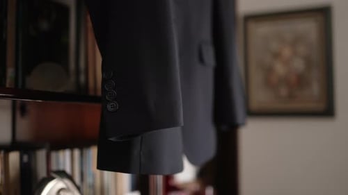Dark Blue Suit Jacket Hanging Indoors