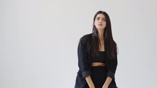 Stylish Woman Posing in Fashionable Black Outfit
