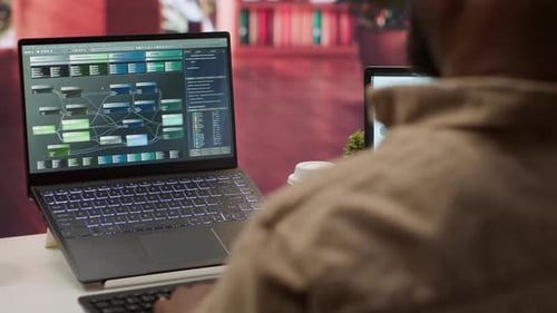 Professional Software Developer at Desk Working on AI Coding