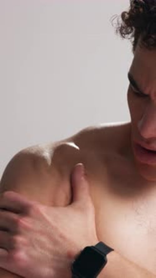 Shoulder pain, fitness and man in studio massage for exercise injury, mistake and workout accident