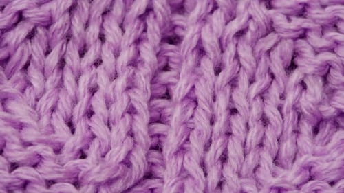 Knitted Purple Woman Warm Grey Sweater or Scarf Textile Macro of Wool Fabric Texture Close Up