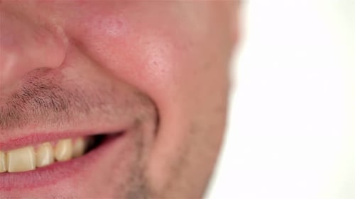 Half of the Human Face Unshaven and Smile