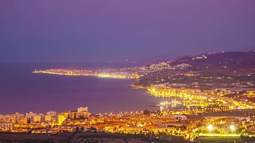 Sunrise over majestic coastal city, panoramic time lapse view