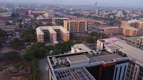 Aerial of a rooftop of a new office building overlooking the beautiful and large city of Abuja,
