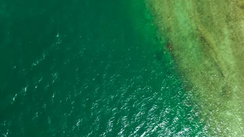 Beautiful turquoise seascape on sunny day from birds eye view.