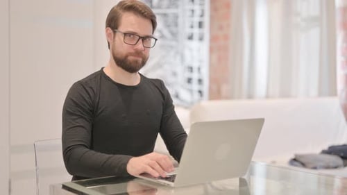 Man Working on Computer Says No