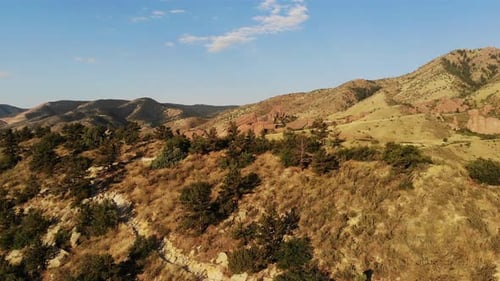 A beautiful rushing pan taken from a drone revealing Red Rocks, Morrison Colorado