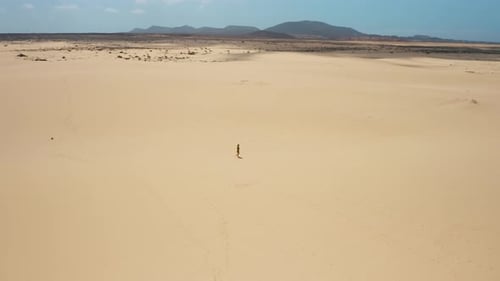 Aerial Flight Over White Sand Dunes in the Desert